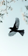 Naklejka premium Silhouette of a Bird in Flight Against a Pastel Sky