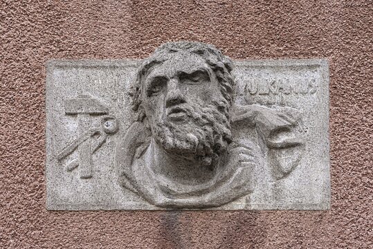 Relief of Vulcanus, roman god of fire and forge on a public building, Erlangen, Middle Franconia, Bavaria, Germany, Europe