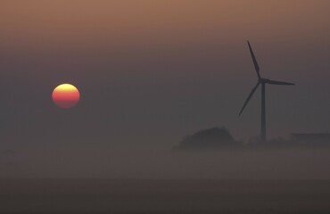 Wind turbine at sunrise, Texel, The Netherlands, Europe