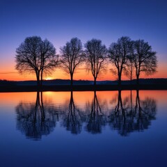 Obraz premium Serene Sunset Reflections on Calm Water