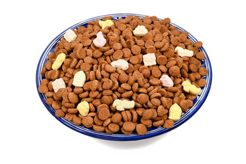 Bowl of kruidnoten, a cookie-like candy made from speculaas in the Netherlands, traditionally served at Sinterklaas celebration