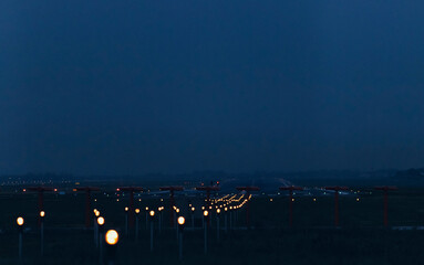 Blurred lines of runway lights at an airport