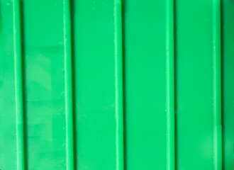 Green plastic floor, smooth texture, green background, abstract background.