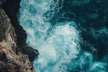 Breathtaking waterfall cascading down Hawaiian cliffs in bright daylight, Tilt shot on beautiful waterfall on Hawaiian cliffside