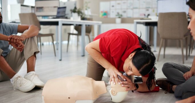 First aid, cpr training and respirator mask with dummy for healthcare, breath or resuscitation for office safety. Paramedic course, medical demonstration and teaching group emergency rescue technique