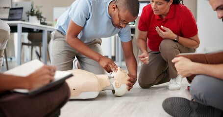 People, mannequin and training in office for first aid, CPR workshop or choking prevention lesson....