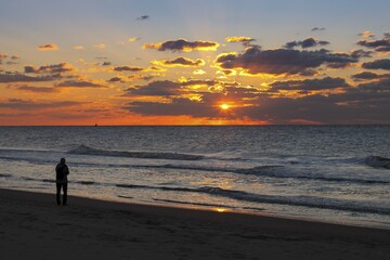 Person on the beach at sunset, Scheveningen, The Hague, Holland, The Netherlands, Europe