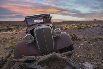 Pampa with old car on a farm in Bosques Petrificados de Jaramillo National Park, Patagonia,...