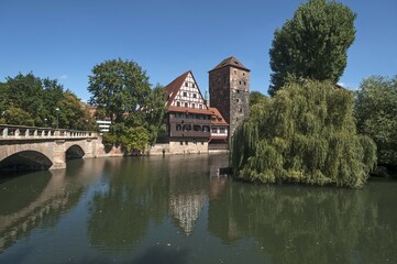 Obraz premium Former leper hospital Weinstadel, half-timbered house, water tower beside Pegnitz, Maxbrücke bridge left, Nuremberg, Middle Franconia, Bavaria, Germany, Europe
