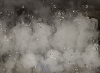 Steam rising from a pot of boiling water