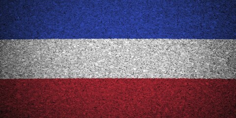 The Serbia and Montenegro flag painted on a cork board