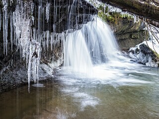 Strümpfelbach brook with icicles in winter, Swabian-Franconian Forest, Baden-Württemberg, Germany, Europe