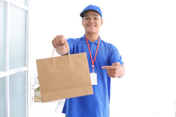 Delivery Man Giving Shopping Bag To Client in Front House