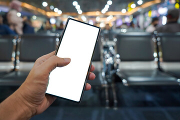 hand holding mobile phone showing white blank screen in the airport terminal