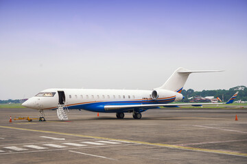 private jet aircraft parked on tarmac