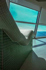 Thermal suite with heated loungers in mosaic tile design or relaxation chairs in spa or wellness...