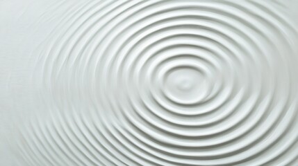 Minimalist abstract image of concentric ripples on a smooth water surface, showcasing a monochrome design.