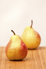 Two pears on a cutting board