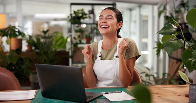Celebration, laptop and online order with woman in flower shop for sale, success or victory. Computer, goals and target in plant nursery with fist pump of florist at desk of small business as winner