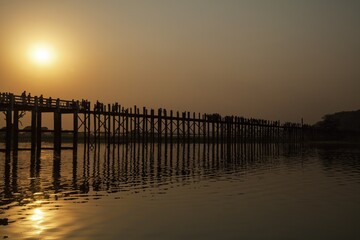 Sunset over U Bein Bridge, Taungthaman Lake, Amarapura, Myanmar, Asia