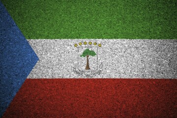 Obraz premium The Equatorial Guinea flag painted on a cork board