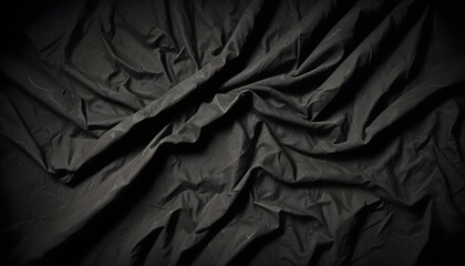 Fototapeta premium Tela negra oscura y arrugada con sombras y luces dramáticas