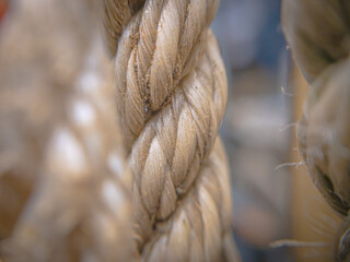 A macro photo showcasing the detailed fibers of a rope, highlighting its texture. Perfect for...