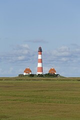 Westerhever Lighthouse with cloud sky, Westerhever, Schleswig-Holstein, Germany, Europe