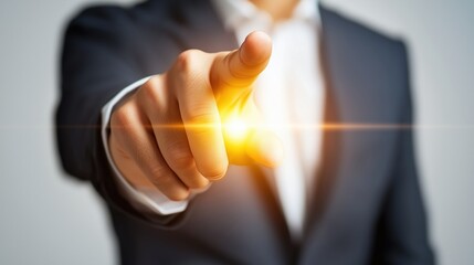Hand pointing forward with glowing light, close-up on decision-making and leadership concepts.
