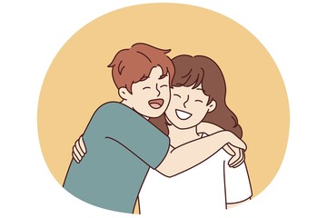 Positive little boy and girl hugging and laughing enjoying spending time together or summer vacation. Concept of happy childhood and friendship between classmates or little brother and sister