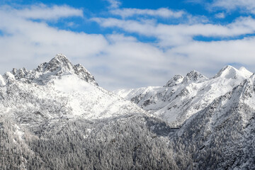 Snow covered Pizzo del Becco and the dams of Sardegnana valley, Val Brembana, Lombardy