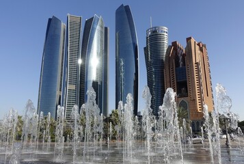 Trick fountains in front of skyscrapers, Abu Dhabi, United Arab Emirates, Asia