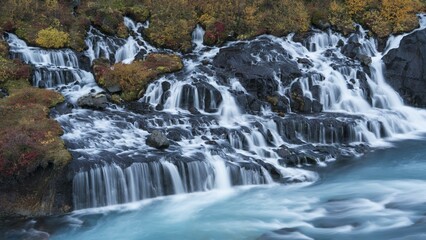 Obraz premium Hraunfossar waterfall in autumn, Vesturland, West Iceland, Iceland, Europe