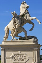 Obraz premium Obotrite tames his horse, sculpture by Christian Genschow about 1873, on the castle bridge, Schwerin, Mecklenburg-Vorpommern, Germany, Europe