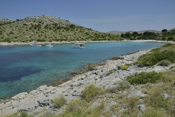Fototapeta premium Excursion boats in Lojena Bay, Levrnaka Island, Kornati islands, Kornati National Park, Adriatic, Croatia, Europe
