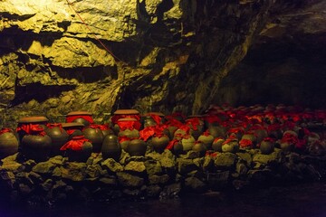 Urns in a cave at Trang An Grottoes in the Tràng An Scenic Landscape Complex, Quan thể danh Thắng Tràng An, Ninh Binh, Vietnam, Asia