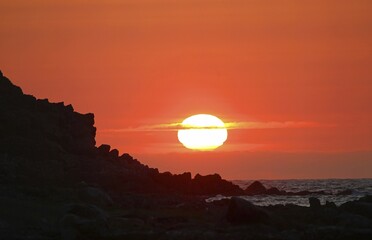 Sunset at rocky coast, island Runde, Norway, Europe