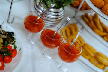 An assortment of appetizers and hot dishes.