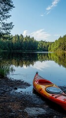 Fototapeta premium Serene Lake Scene with Single Orange Kayak at Tranquil Shoreline
