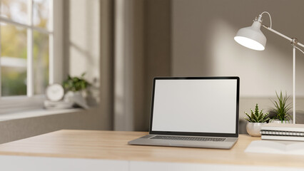 A close-up of a laptop on a minimalist wooden table in a white contemporary room.