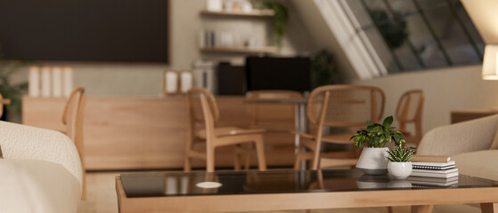 A minimalist wooden coffee table surrounded by sofas in a cozy, contemporary coffee shop.