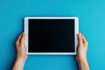 Ultra Quality Image of Close Up Hands Holding Horizontal Ipad Tablet in Blue Background
