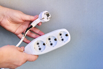 Extension cord overload, charred electrical cord with tee.