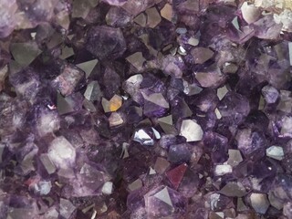 purple crystals of quartz as a background, closeup of photo