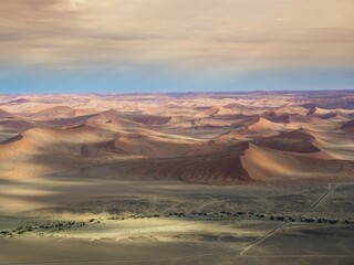 Fototapeta premium Aerial, view of sand dunes, Kulala Wilderness Reserve on the edge of the Namib Desert, Tsaris Mountains, Sossusvlei, Region Hardap, Namibia, Africa