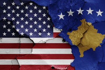Flags of USA and Kosovo painted on cracked wall