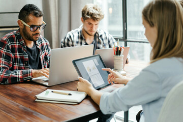 Obraz premium Group of young people working together. Creative business people in modern office