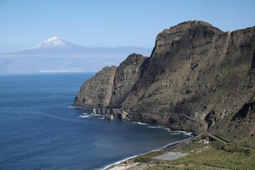 Cliffs, North Coast in Agulo, behind the Teide on Tenerife, La Gomera, Canary Islands, Spain, Europe