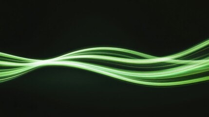 Green light trails flowing smoothly on dark background
