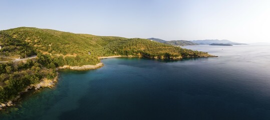 Fototapeta premium Aerial view, Milina bay in the evening, Trikeri-Milina, Volos region, Straits of Trikiri, Pelion peninsula, Pagaitic gulf, Greece, Europe